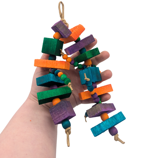 Balsa Triathlon by Lil Monsters Bird Toys. Held in hand for scale. 