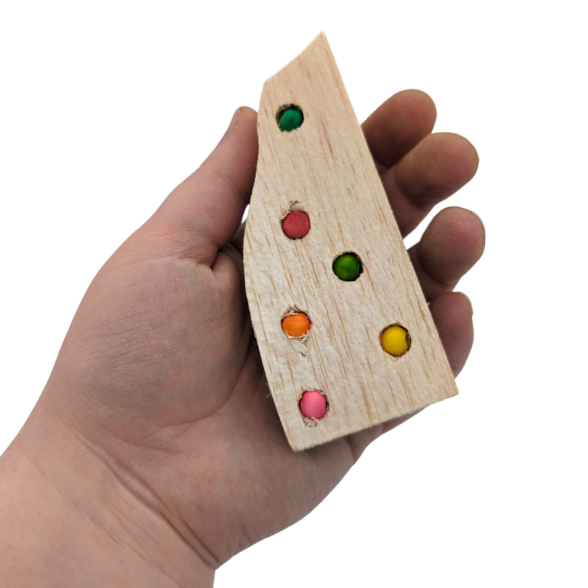 Balsa Waste Knots by Lil Monsters Bird Toys, held in hand for scale