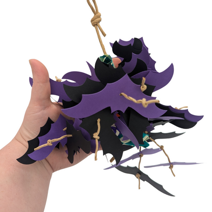 Belfry Halloween Parrot Toy by Lil Monsters Bird Toys, in hand for scale