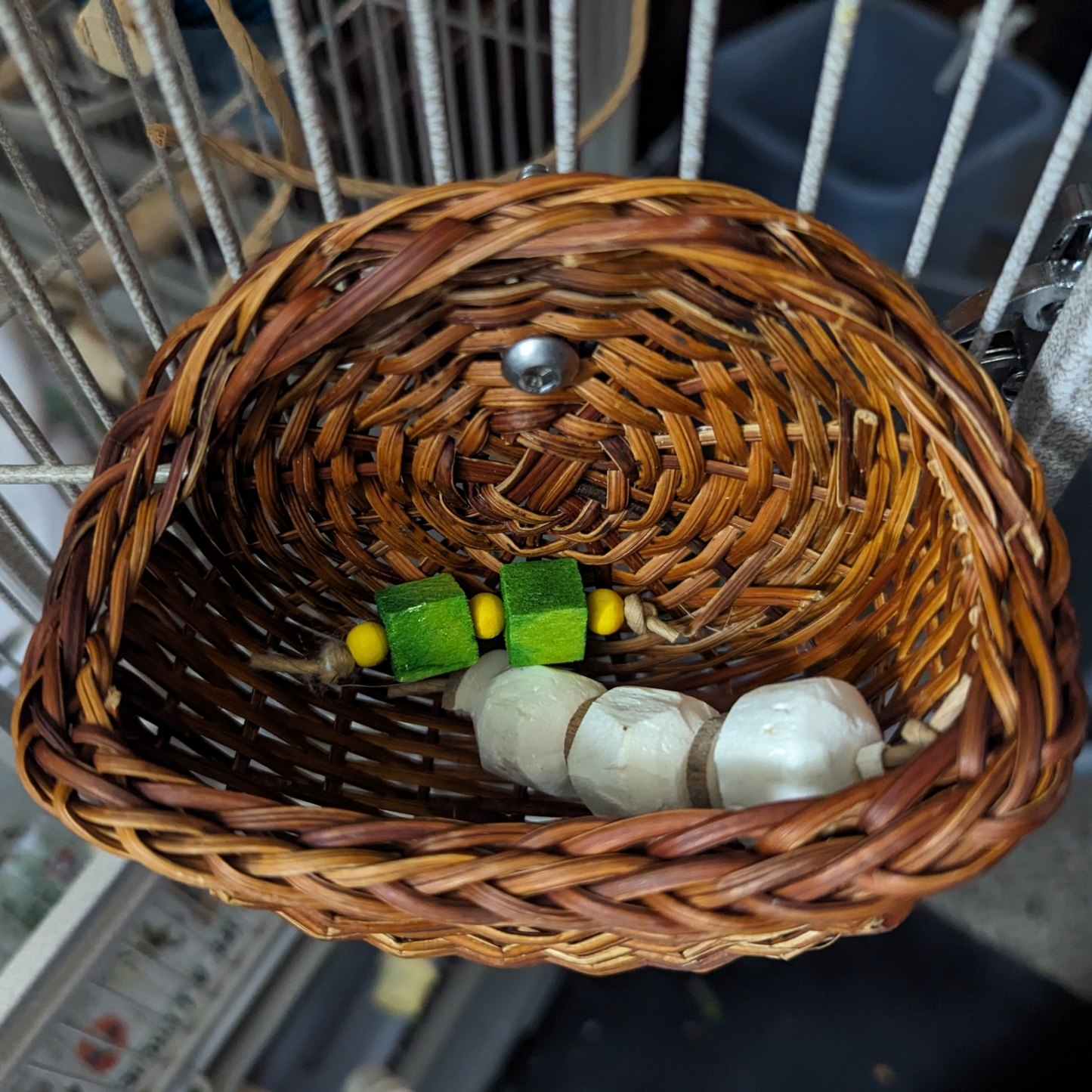 Toy Basket for foot toys by Lil Monsters Bird Toys, shown with foot toys to demonstrate usage