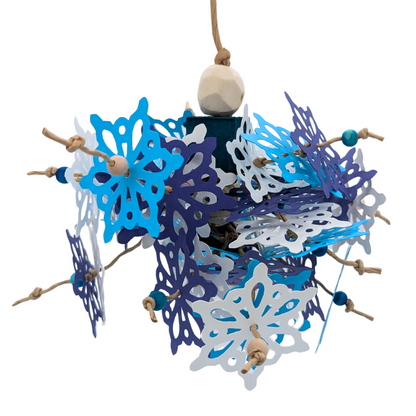 Blizzard Parrot toy by Lil Monsters Bird Toys, with cardstock snowflakes, balsa, cork, and sola