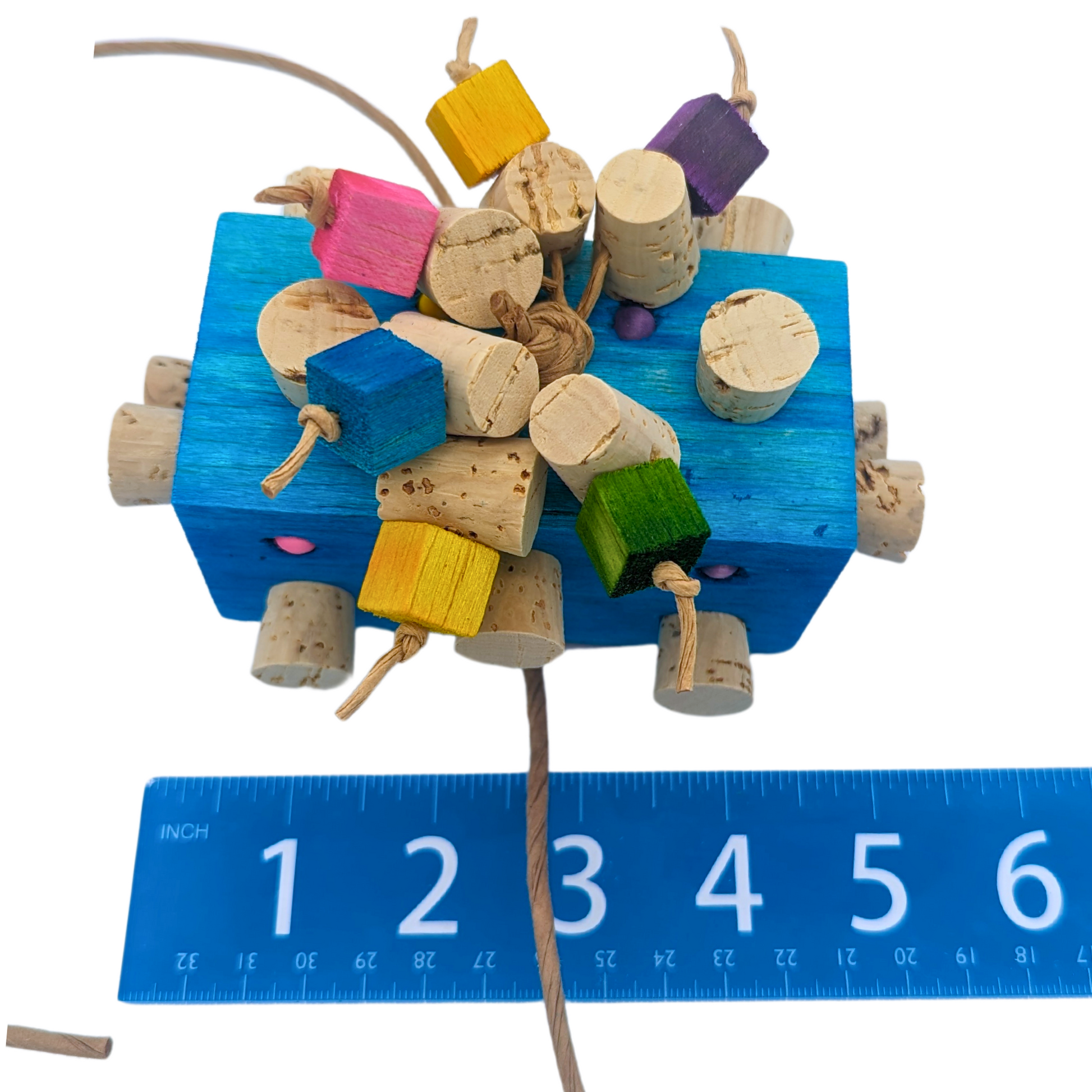 Blockbuster parrot toy by Lil Monsters Bird Toys, shown next to ruler for scale