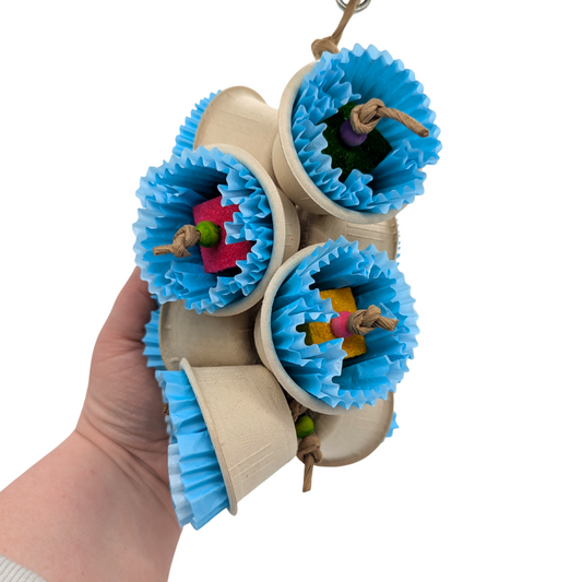 Bluebells bird toy by Lil Monsters Bird Toys, held in hand for scale