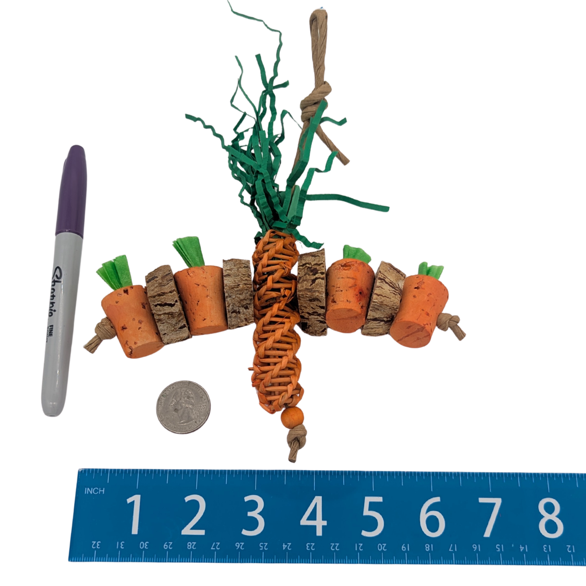 Carrot Patch by Lil Monsters Bird Toys. Shown next to a ruler, sharpie marker, and US quarter for scale. 