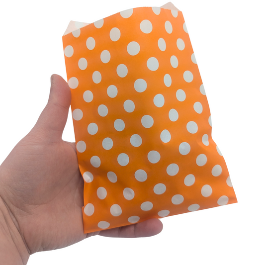 Chip Bag Bird Toy by Lil Monsters Bird Toys, bag held in hand for scale