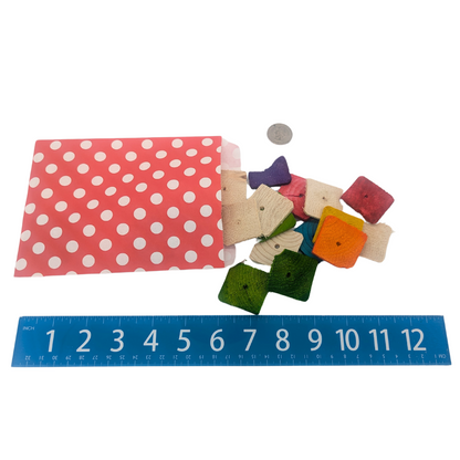 Chip Bag Bird Toy by Lil Monsters Bird Toys, bag and pine chips next to ruler for scale