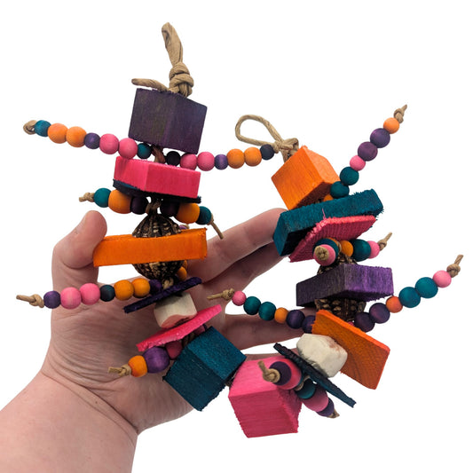 Cravings by Lil Monsters Bird Toys. Held in hand for scale, and a different color scheme to highlight that colors will vary. 