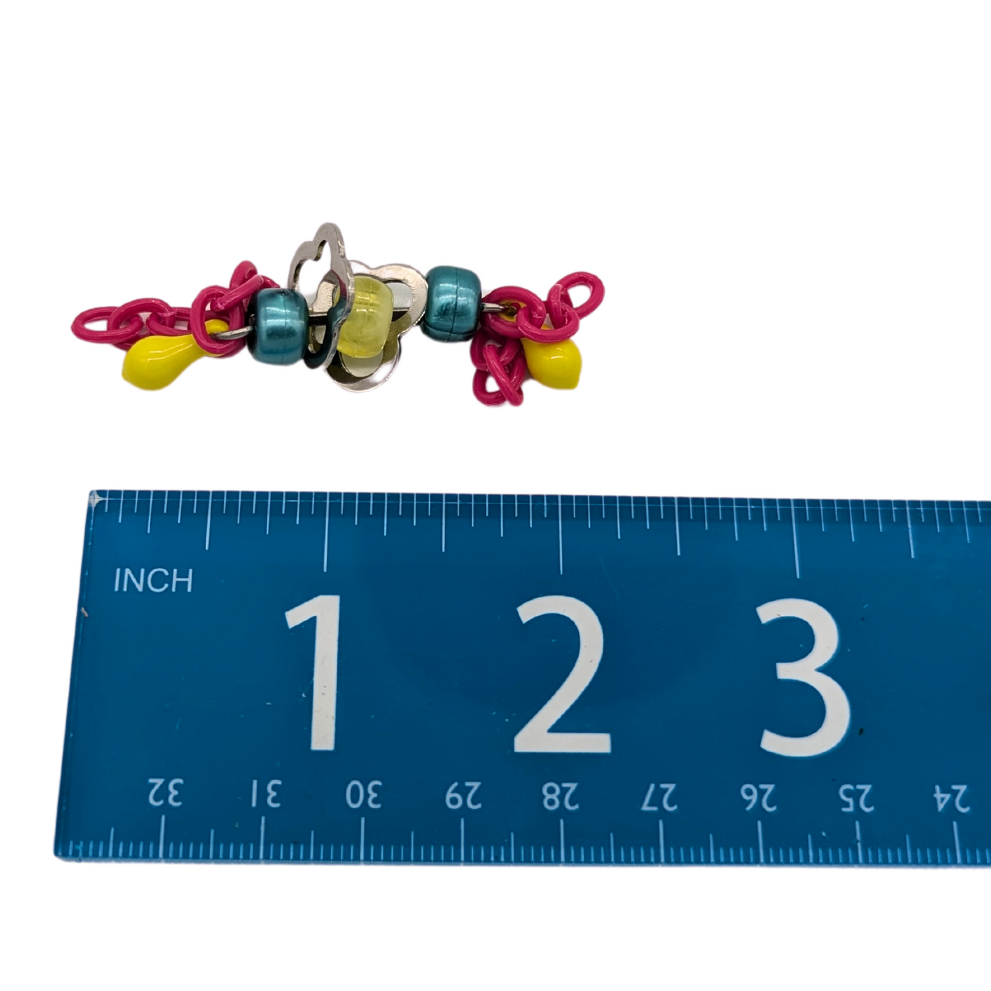 Fiddlin Sticks foot toy for birds by Tiny Conure Trinkets, next to ruler for scale