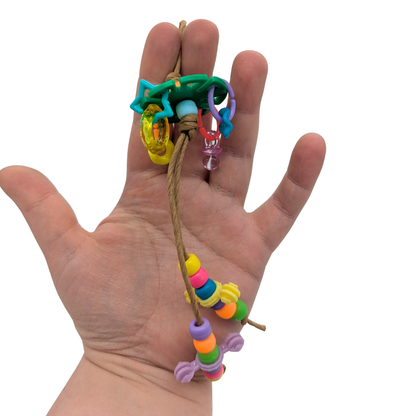 Fidget by Lil Monsters Bird Toys. Held in hand for scale. 