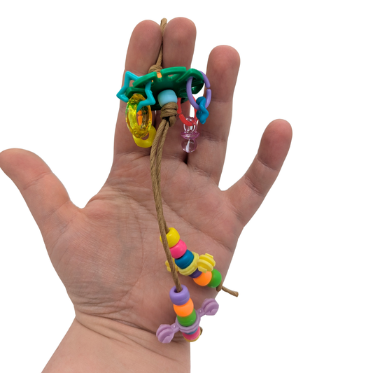 Fidget by Lil Monsters Bird Toys. Held in hand for scale. 