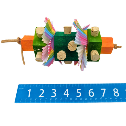 Finnegan St Patrick's Day themed bird toy by Lil Monsters Bird Toys, next to ruler for scale