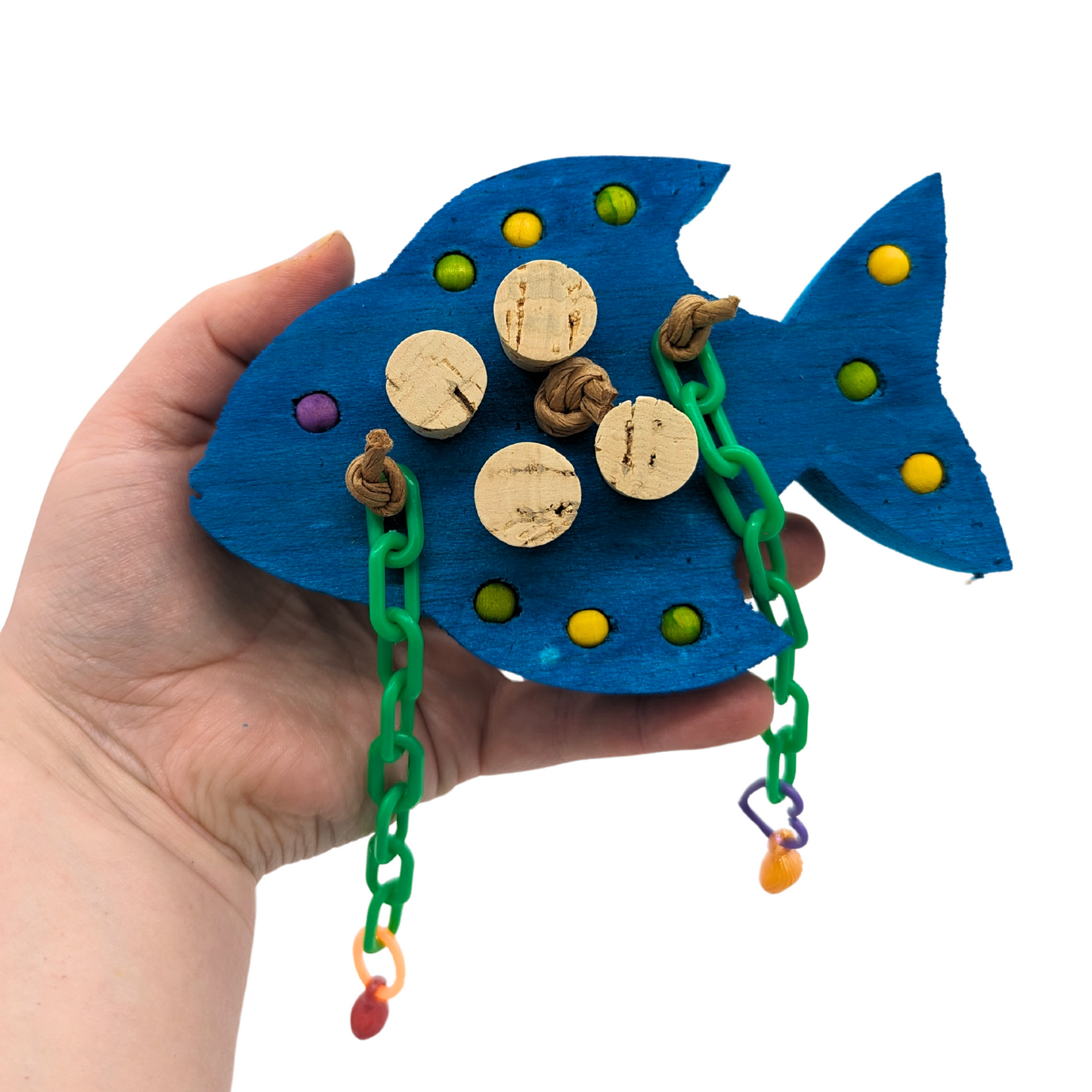 Gilligan foraging bird toy by Lil Monsters Bird Toys, in hand for scale