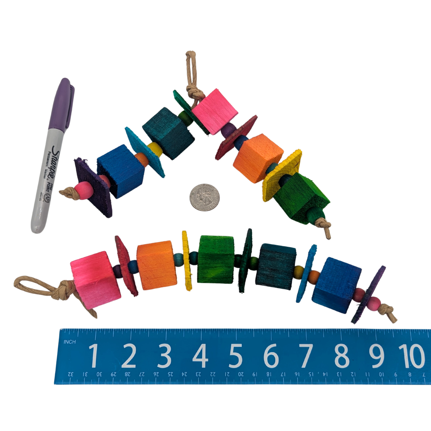 Hugh by Lil Monsters Bird Toys. Arched and linear examples shown next to a ruler, US quarter, and sharpie marker for scale. 