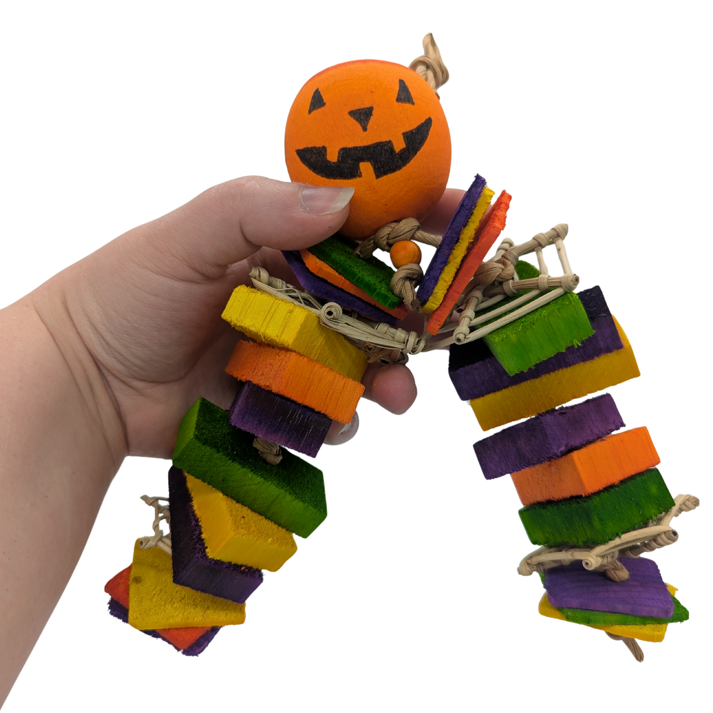 Ichabod Halloween parrot toy by Lil Monsters Bird Toys, held in hand for scale