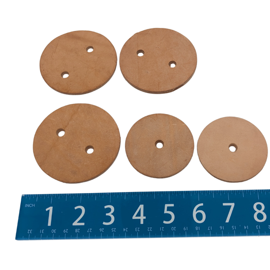 Leather Circles (Pack of 5) by Lil Monsters Bird Toys, next to ruler for scale