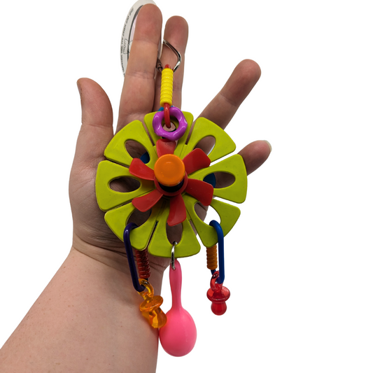 Maraca Flower bird toy by Super Bird Creations, held in hand for scale
