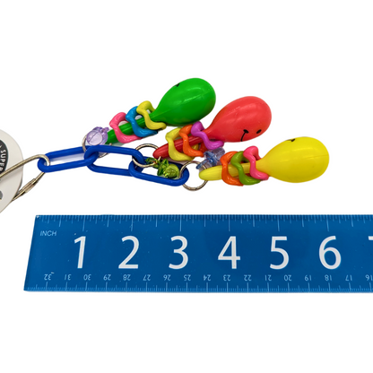 Maraca Mania small parrot toy by Super Bird Creations, next to ruler for scale