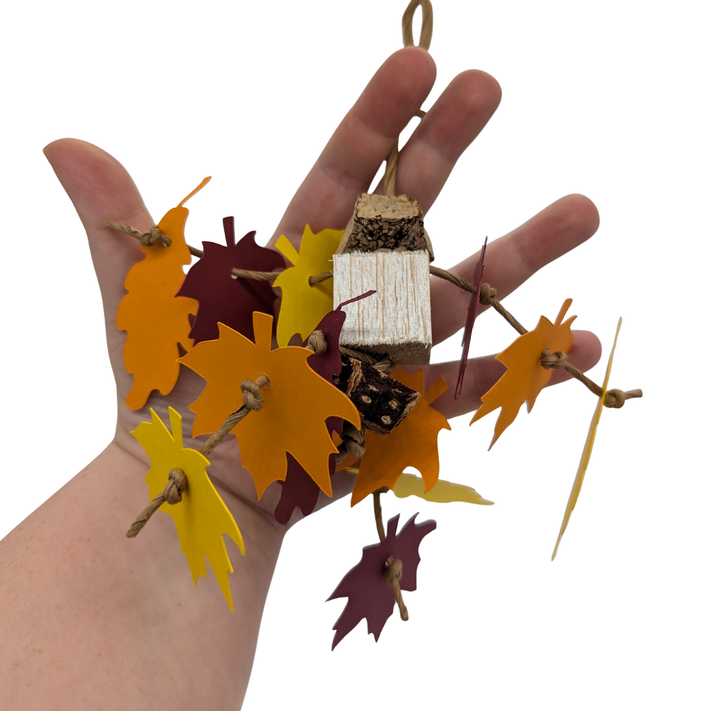 Mini Foliage parrot toy by Lil Monsters Bird Toys, held in hand for scale