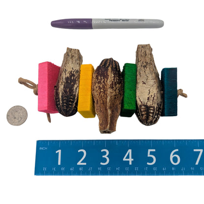 Mocha by Lil Monsters Bird Toys. Shown next to a ruler, Sharpie marker, and US quarter to show scale. 