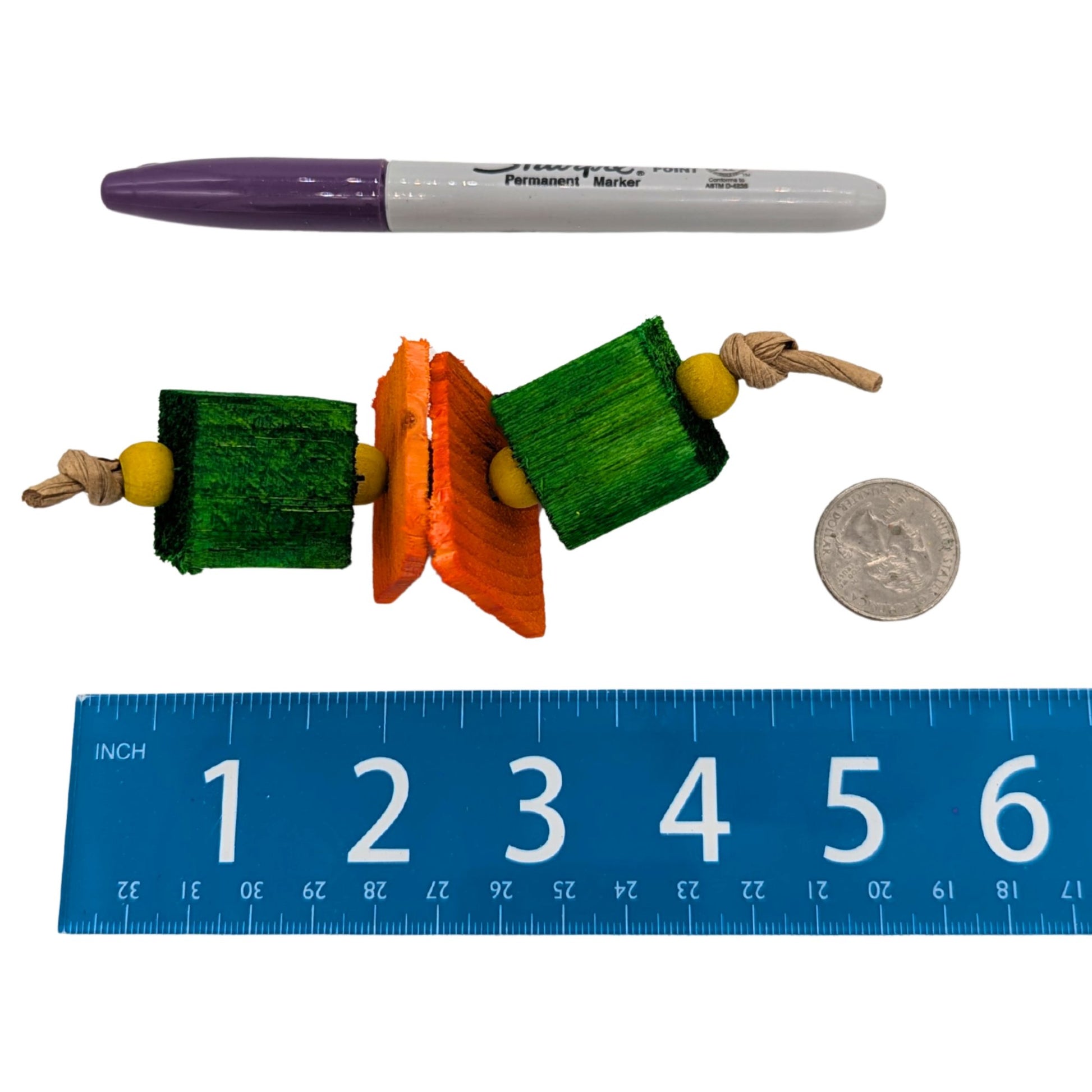 Munchie by Lil Monsters Bird Toys. Next to a US quarter, sharpie marker, and ruler for scale. 