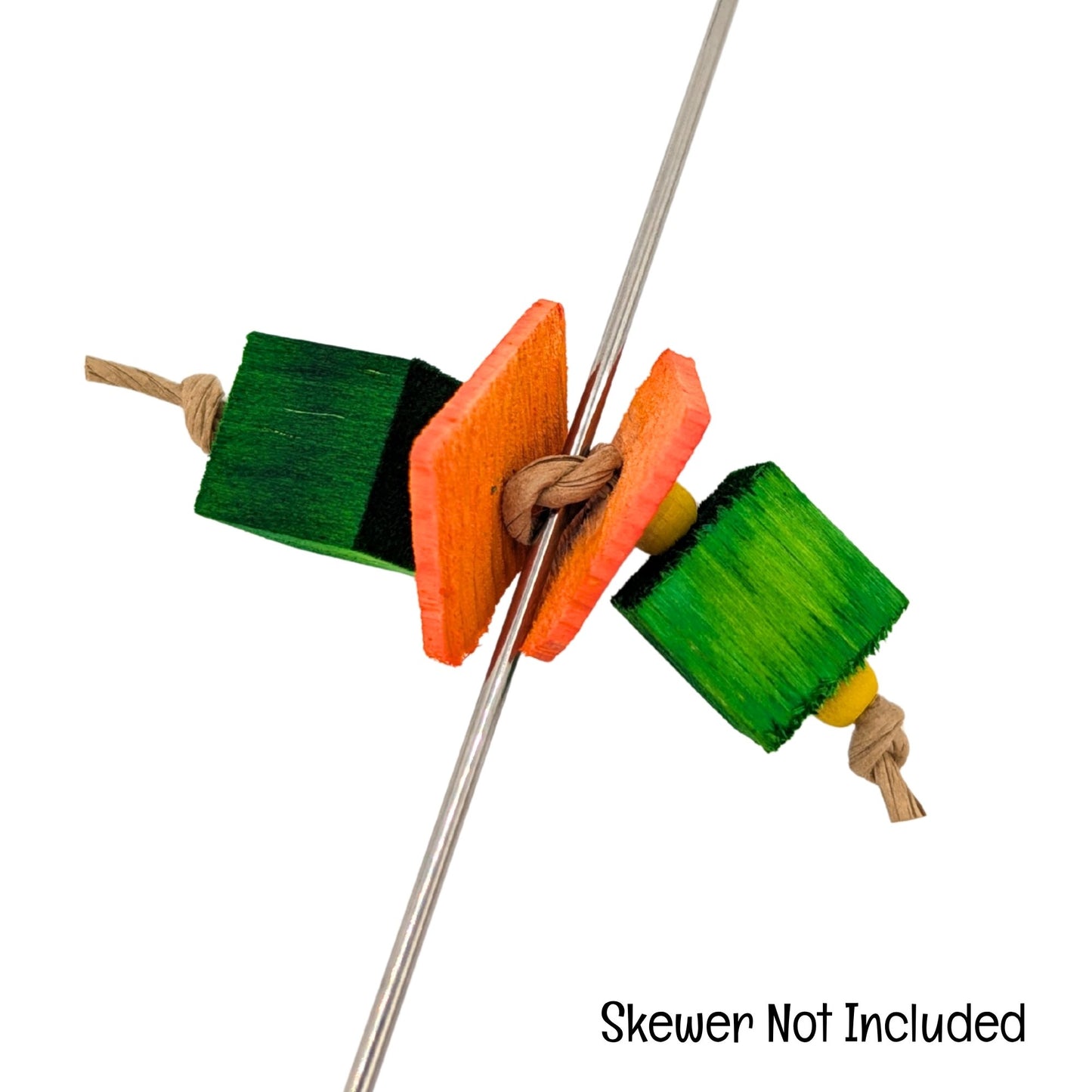 Munchie by Lil Monsters Bird Toys. Shown on a skewer as a demonstration. Text overlay says "skewer not included."