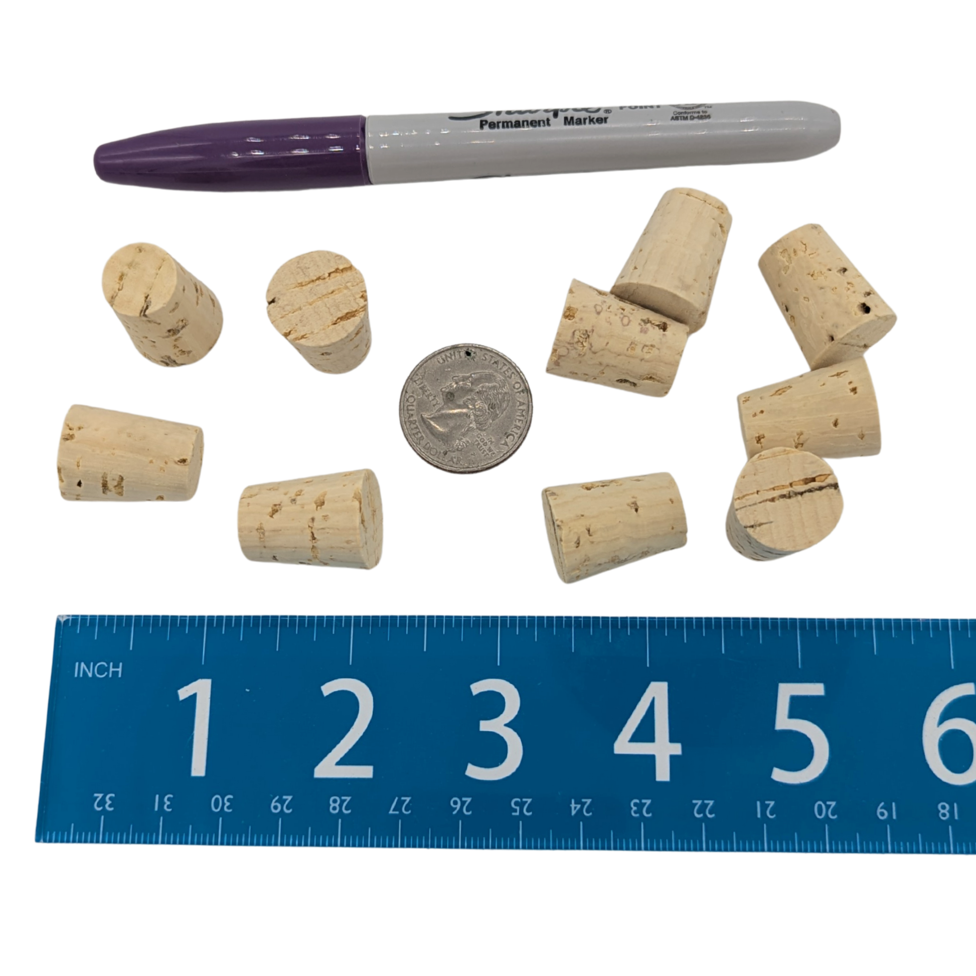 Natural Cork Stoppers (10 pack) by Lil Monsters Bird Toys next to a sharpie, ruler, and US quarter for scale
