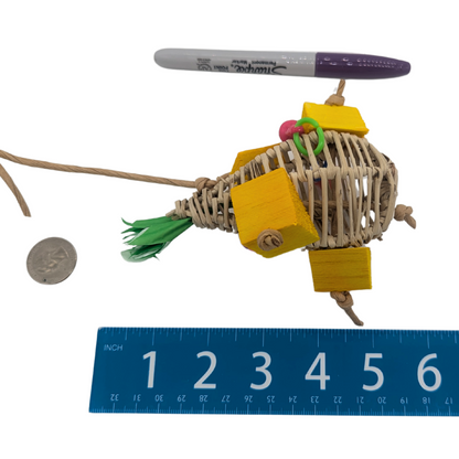 Pina Colada summer themed parrot toy by Lil Monsters Bird Toys, next to a marker, ruler, and US quarter for scale. 