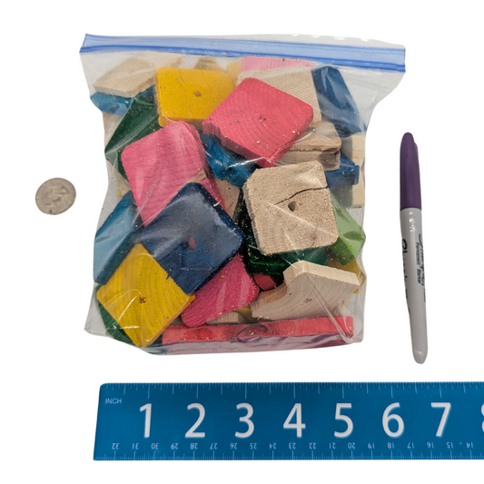 Quart bag of Pine Scraps by Lil Monsters Bird Toys, next to a sharpie, ruler, and US quarter for scale