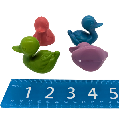 Plastic Duck 4 Pack by Lil Monsters Bird Toys, shown next to ruler for scale, side view