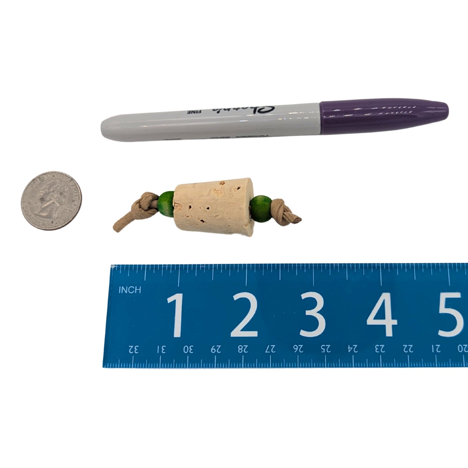 Popper Foot Toy by Lil Monsters Bird Toys. Shown next to a US quarter, Sharpie marker, and ruler for scale. 