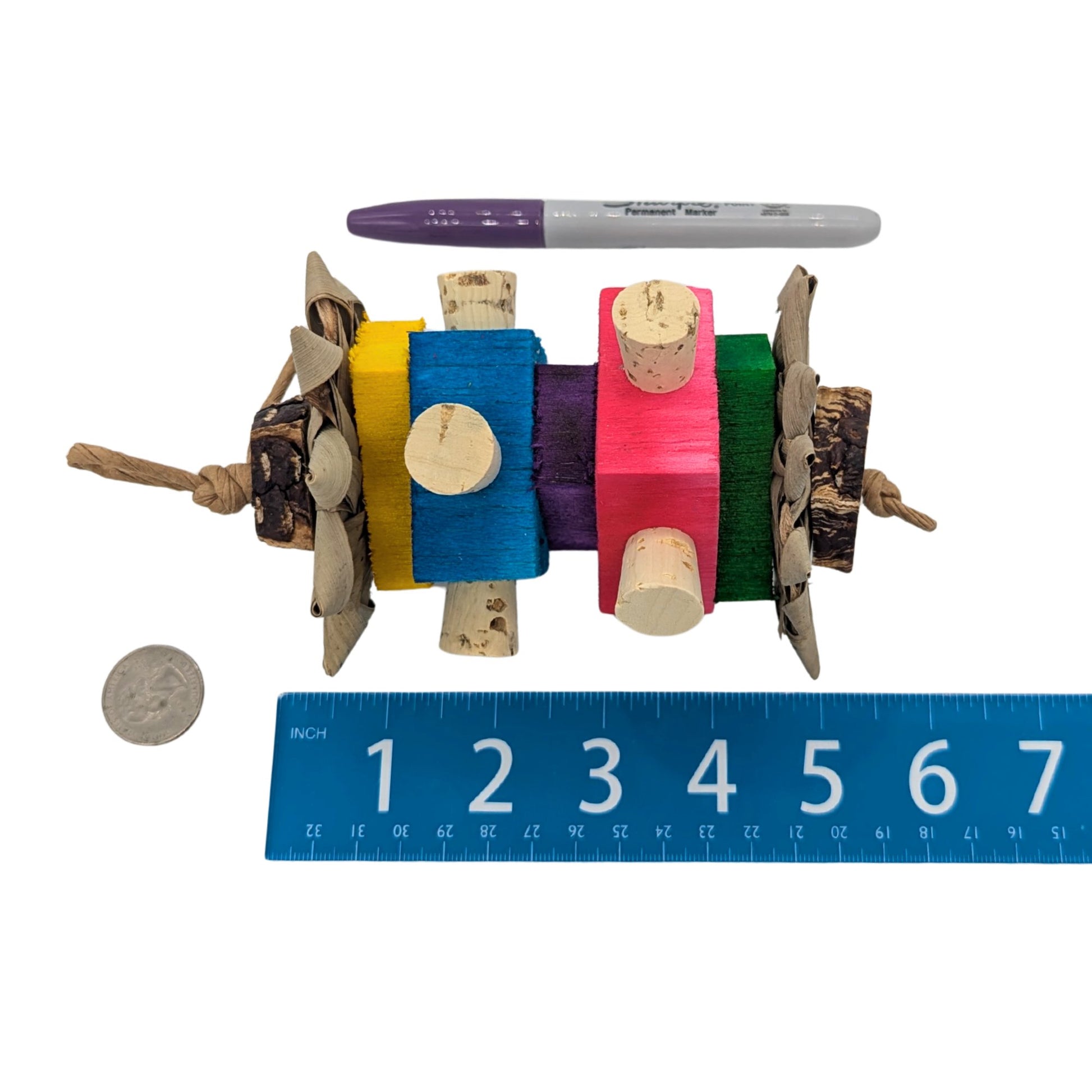 Prim by Lil Monsters Bird Toys. Shown next to a ruler, US quarter, and sharpie marker for scale. 