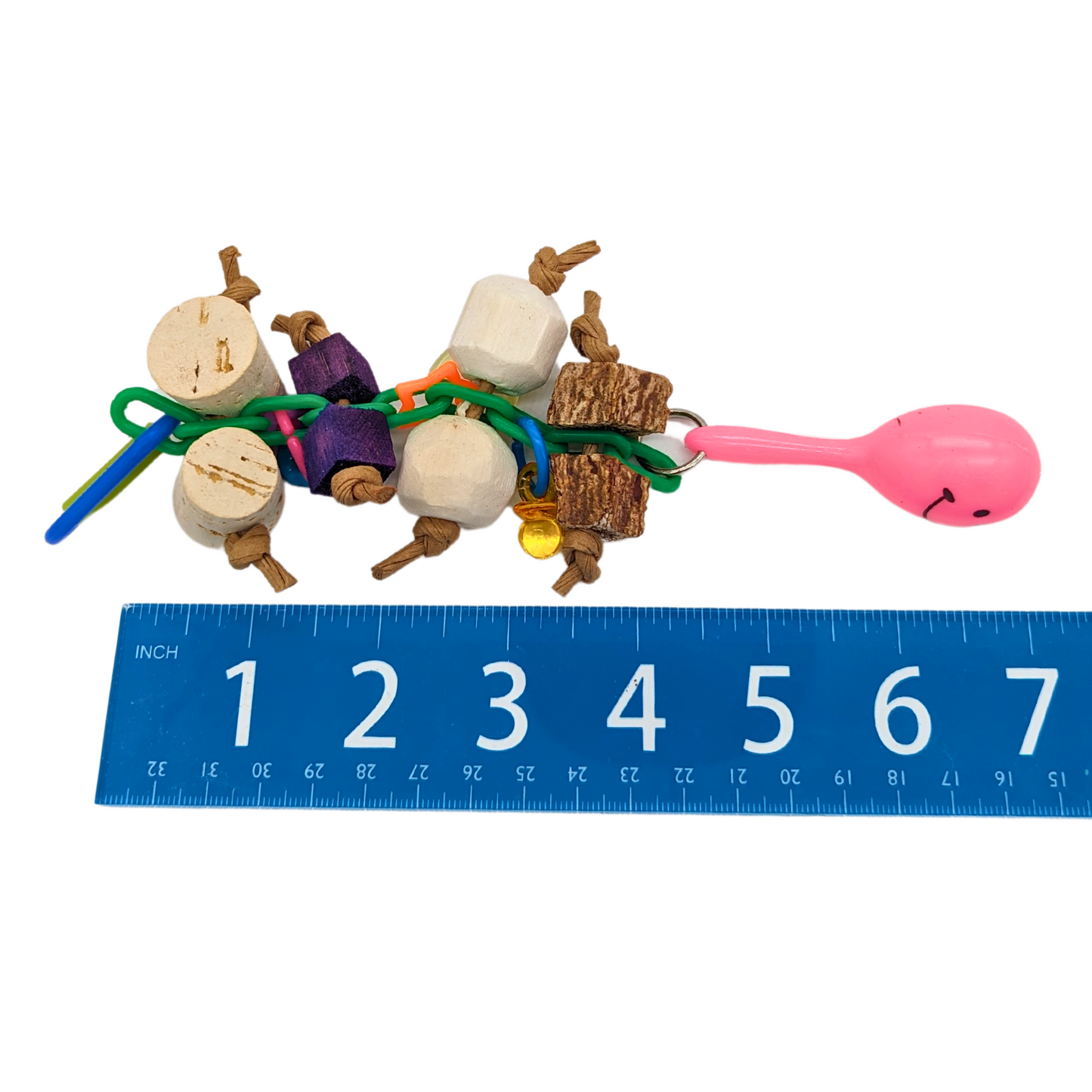 Shake Rattle and Chew bird toy by Lil Monsters Bird Toys, next to ruler for scale