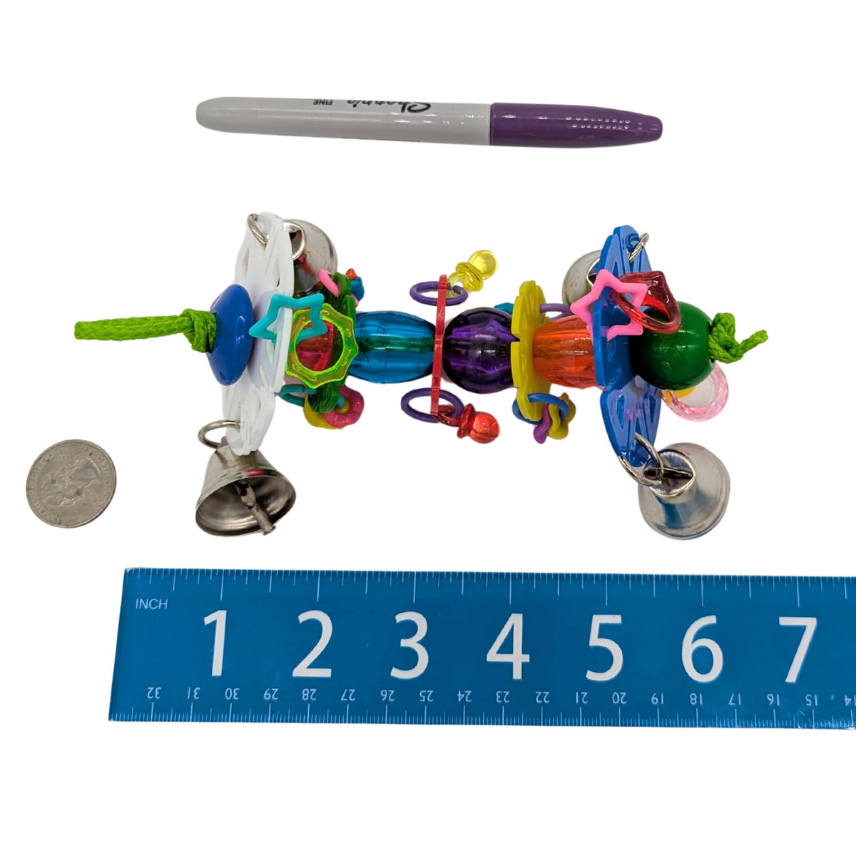 Shimmy by Lil Monsters Bird Toys. Shown next to a US quarter, Sharpie marker, and ruler for scale.