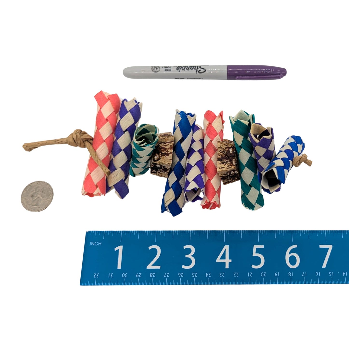 Simply Put by Lil Monsters Bird Toys. Shown next to a US quarter, Sharpie marker, and ruler for scale. 