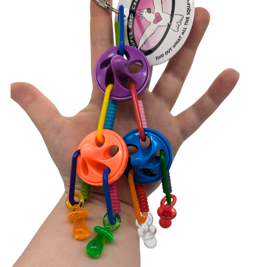 Top This bird toy by Super Bird Creations, in hand for scale