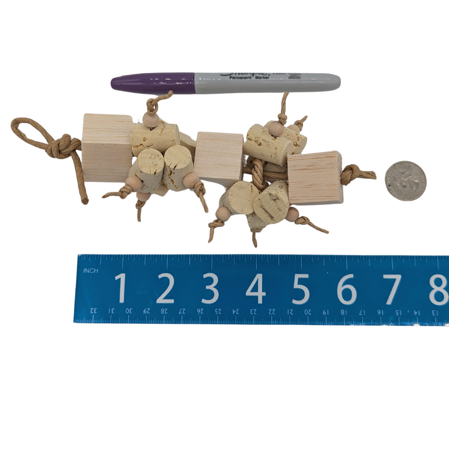Uncorked by Lil Monsters Bird Toys. Next to ruler, US quarter, and sharpie marker for scale. 