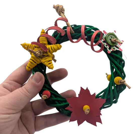 Wreath by Lil Monsters Bird Toys. Held in hand to show scale. 