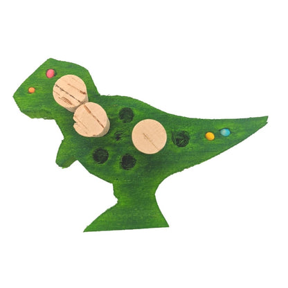 Balsasaurus Rex by Lil Monsters Bird Toys. A piece of balsa cut into the shape of a t-rex dinosaur. Embedded with cork stoppers, small beads, and has larger holes ready to be filled with treats. Shown in a green color.