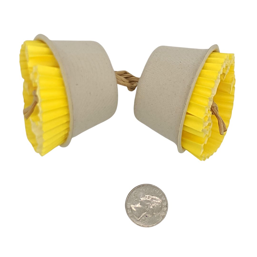 A bird toy shown on a skewer. Consists of plant based fiber cups with cupcake liners and 1 inch balsa blocks tucked inside.