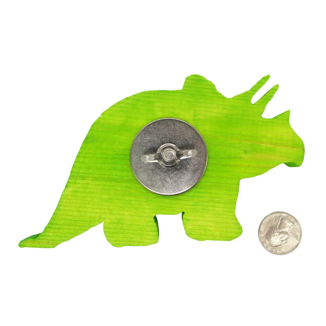 A triceratops shaped piece of wood. Showing stainless steel hardware option. Shown next to US quarter for scale