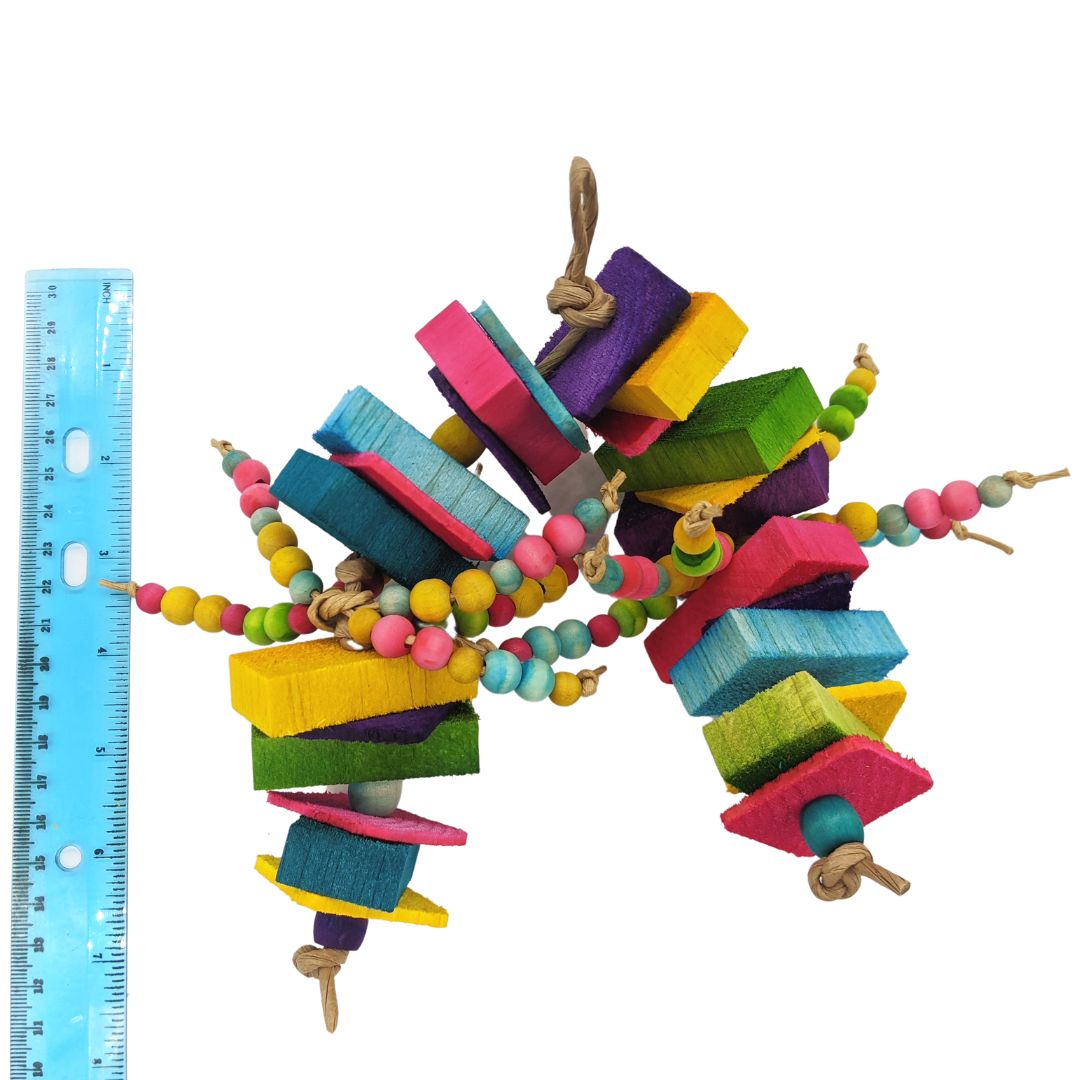 A brightly colored parrot toy. Has alternating sections of 1/8 thin pine with 1/2 inch balsa slats, separated by 1/2 inch wooden barrel beads. In the middle of the toy are two sections of 6 strands each of 8mm and 10mm wooden beads.