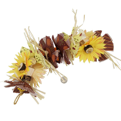 A fall themed bird toy that hangs from both ends like a garland. Has raffia, balsa blocks, and cupcake liners cut and layered to resemble sunflowers.