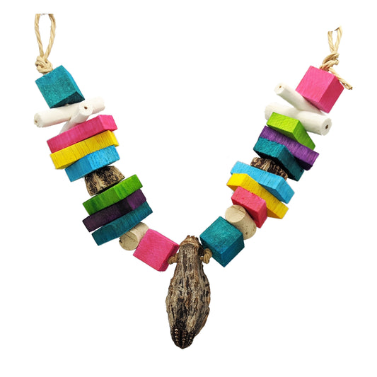 Balsa Garland by Lil Monsters Bird Toys. Features 1 inch balsa blocks, cork stoppers, mahogany pod slices, sola sticks, and half inch thick balsa slats. In the center is a whole mahogany pod. 
