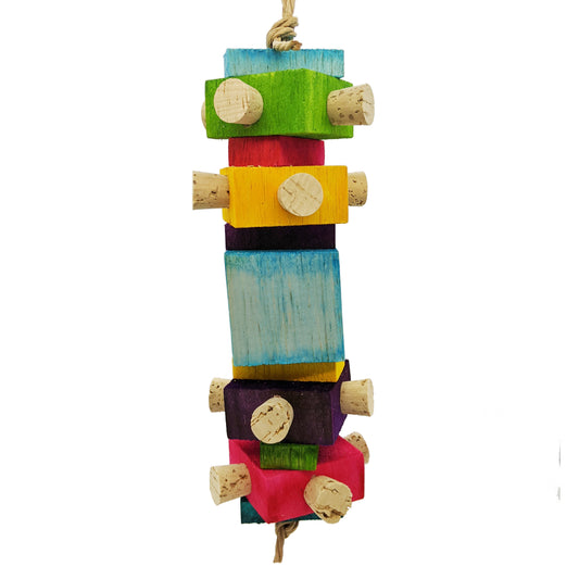 Balsa Spire by Lil Monsters Bird Toys. Balsa stacked on top of each other. Alternating 1" thick, 1/2" thick, and a 2" block. 1" thick pieces have 4 corks embedded in them. 