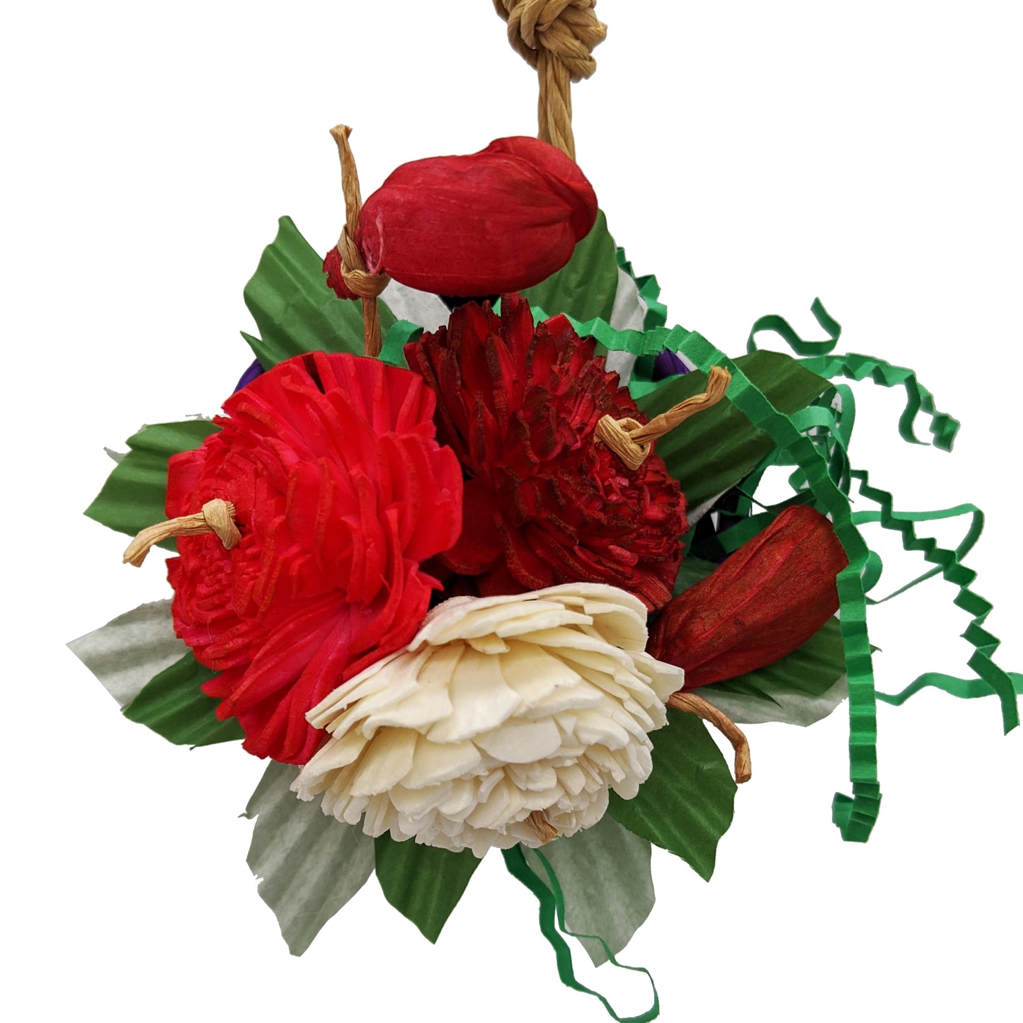 A bird toy with a basket, overflowing with 3 sola flowers dyed red, white, and pink. With shred paper and cupcake liners. 