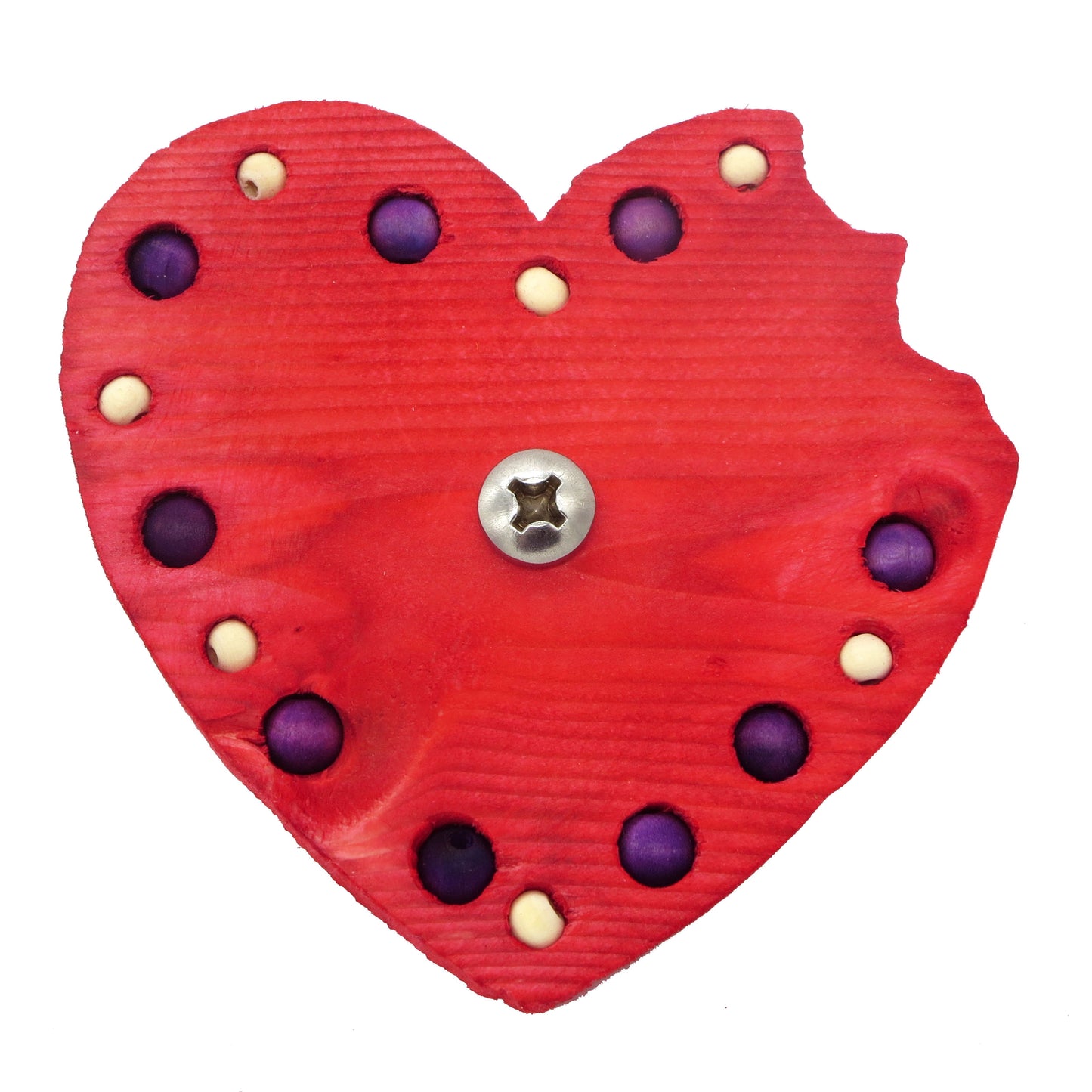 A heart shaped piece of pine with a "bite" taken out of the right lobe. Embedded with 8mm and 6mm beads around the border. 