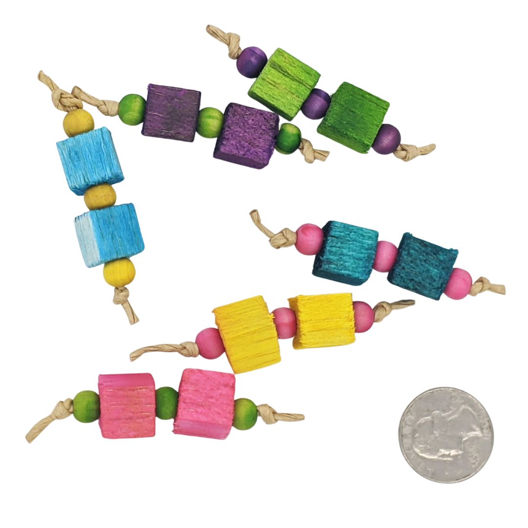 A small foot toy composed of three 8mm wood beads separated by two 1/2" balsa blocks.  Showing multiple colors
