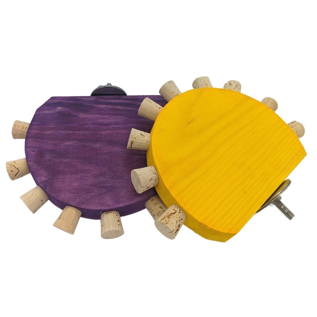 Cork Nook by Lil Monsters Bird Toys. Shown in two colors: yellow and purple. 