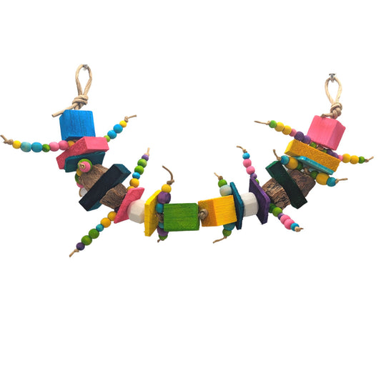 Cravings by Lil Monsters Bird Toys. A colorful bird toy made of wood beads, balsa, sola, mahogany, and thin pine, strung together in a garland style.
