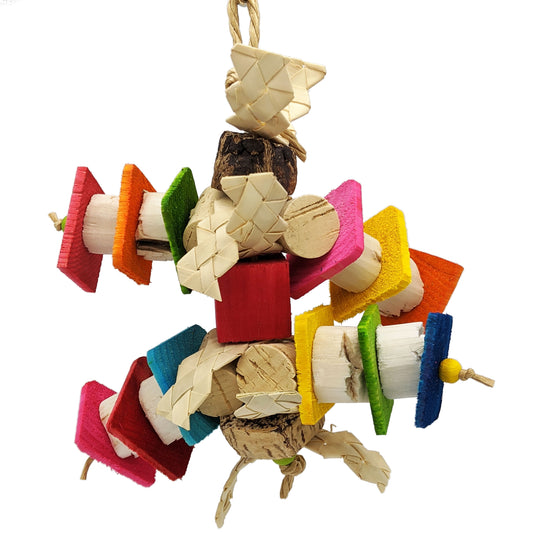 Hodgepodge Lite by Lil Monsters Bird Toys. A colorful bird chew toy made of thin pine slices, cork, sola, and mahogany pods, all strung together on paper rope.